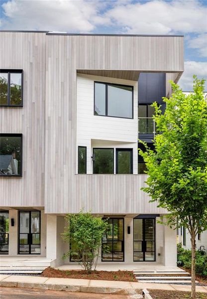 Front exterior of a new home in , Chattahoochee Hills, GA, highlighting curb appeal (Image 1).