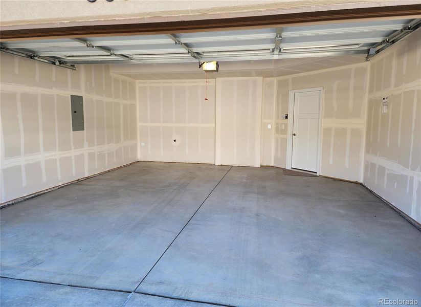 Two-car garage is drywall finished and has a hose hookup.