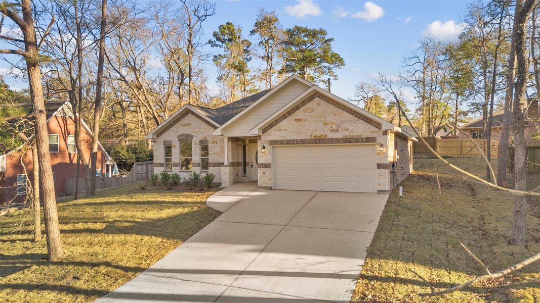 Front exterior of a new home in , Huntsville, TX, highlighting curb appeal (Image 19). Front exterior of a new home in , Huntsville, TX, highlighting curb appeal (Image 19).