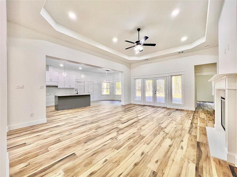 Living Room is has Beautiful Wood-like Tile and an Impressive Outdoor View from all the Living Room & Formal Dining Windows, you must see in person to feel and appreciate.