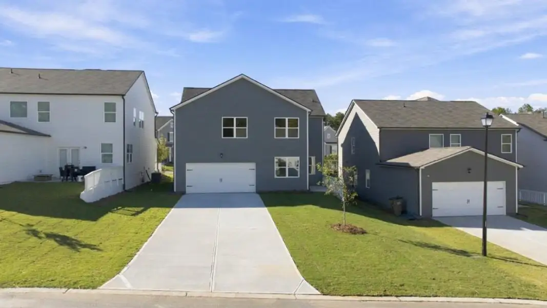 Front exterior of a new home in Braselton Village, Braselton, GA, highlighting curb appeal (Image 12).
