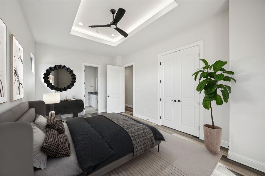 Virtually staged upstairs guest bedroom featuring a 10' raised ceiling, ensuite bath, and ample space for clothing storage and workspace. (Bedroom 5 of 5)