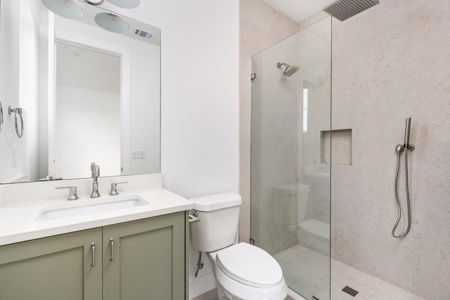 Full bath with vanity and a walk in shower