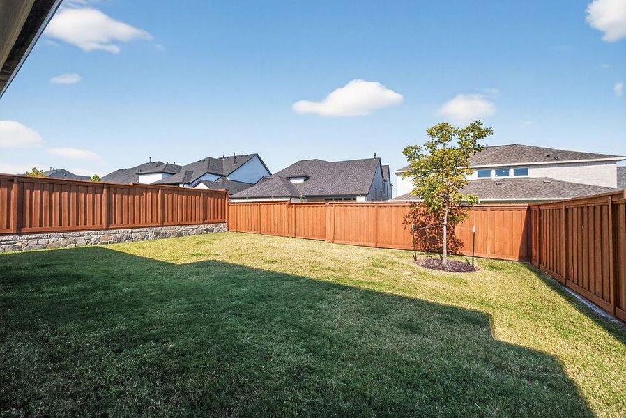 Fenced backyard featuring a residential view Fenced backyard featuring a residential view
