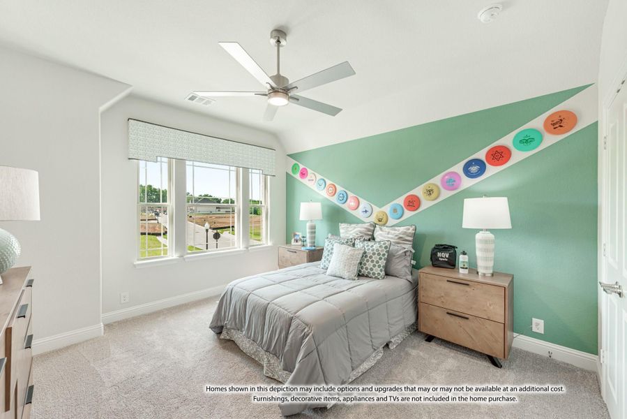 Bedroom with teal accent wall, ceiling fan, vaulted ceiling, and colorful disc decorations above the bed Bedroom with teal accent wall, ceiling fan, vaulted ceiling, and colorful disc decorations above the bed