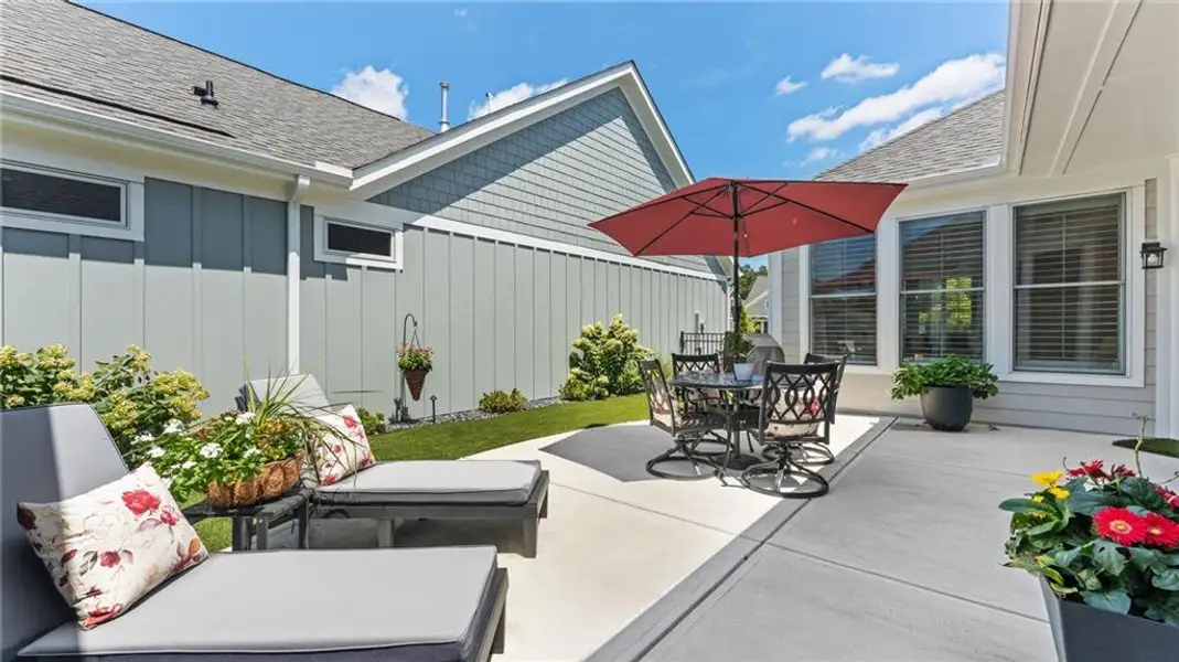 Exterior details and patio area of a home in The Courtyards at Bailey Farms, Dacula (Image 25).