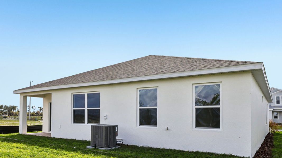 Representative exterior photo of a completed home built from the Baker by DRB Homes in Willowbrook North, Winter Haven, FL (Image 27).