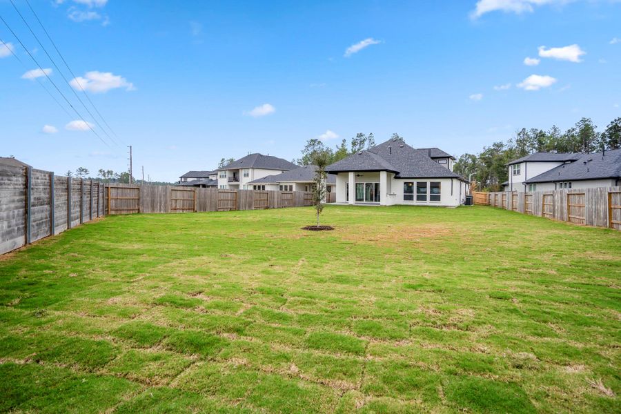 Exterior details and patio area of a home in ARTAVIA 55' Lots, Conroe (Image 30).