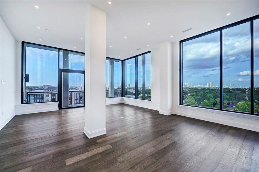 The expansive great room sets the stage for lavish entertaining with a generous footprint for living and dining areas surrounded by bold columns and the home's signature views.