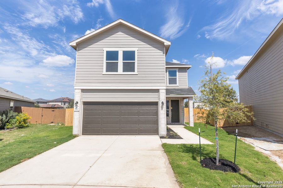Front exterior of a new home in Marbella, San Antonio, TX, highlighting curb appeal (Image 1).