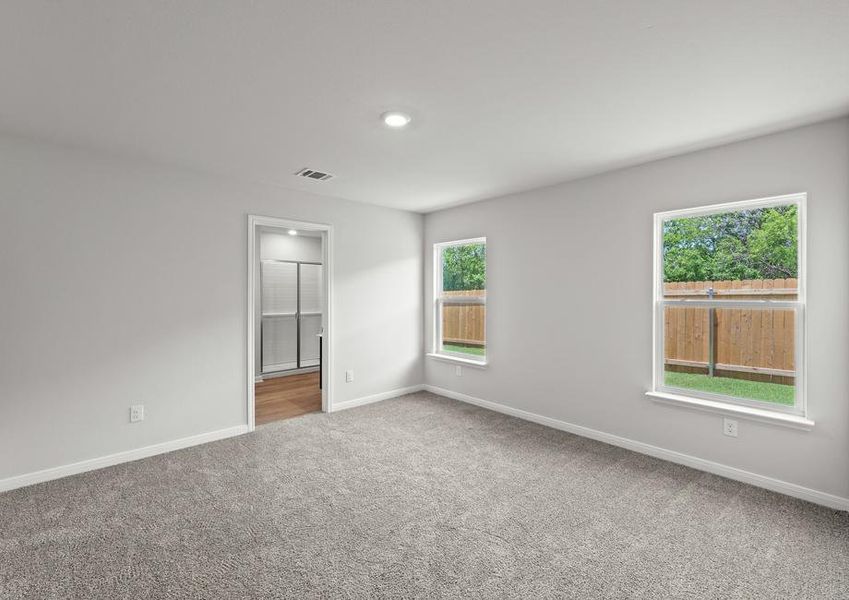 The master suite of the Cedar plan has a spacious bedroom, en-suite bathroom and large walk-in closet.