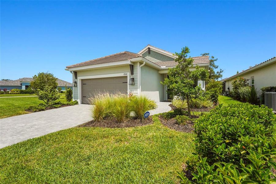 Front exterior of a new home in , Sarasota, FL, highlighting curb appeal (Image 28).