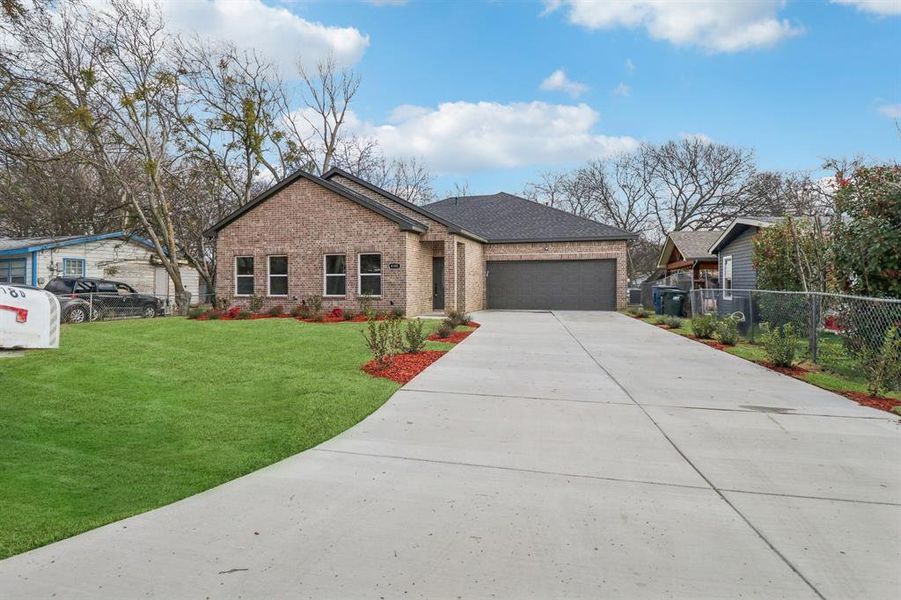 Front exterior of a new home in , Lancaster, TX, highlighting curb appeal (Image 19). Front exterior of a new home in , Lancaster, TX, highlighting curb appeal (Image 19).