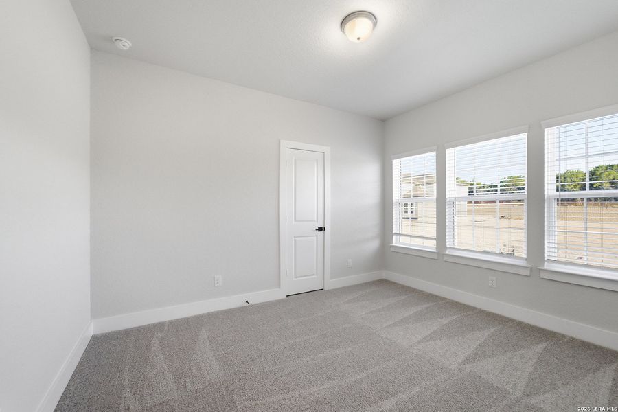 Spacious, unfurnished interior of a new home in The Woodlands at Medina Hills, Mico (Image 32).