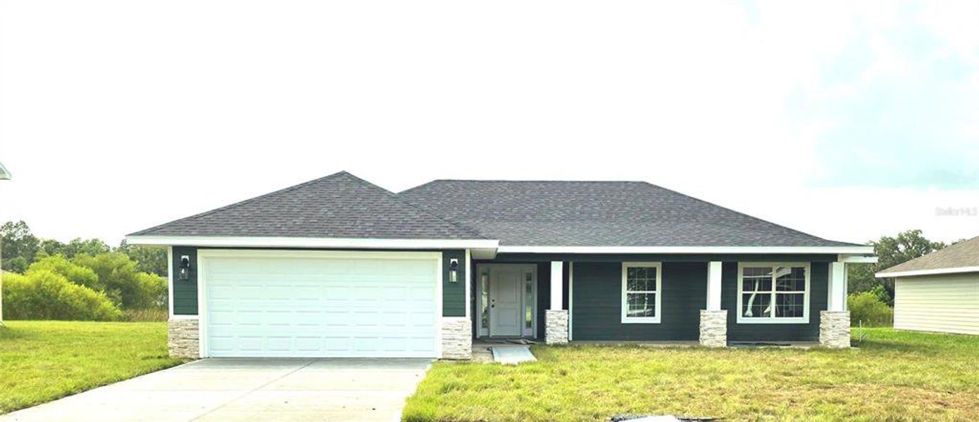 Front exterior of a new home in The Preserve at Laurel Lake, Lake City, FL, highlighting curb appeal (Image 1).