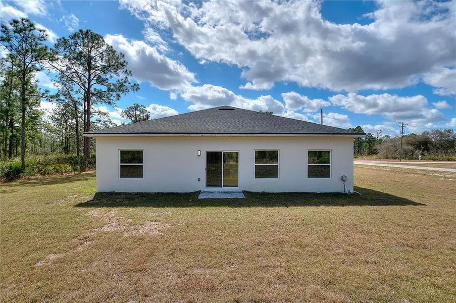 Exterior details and patio area of a home in , Indian Lake Estates (Image 3).