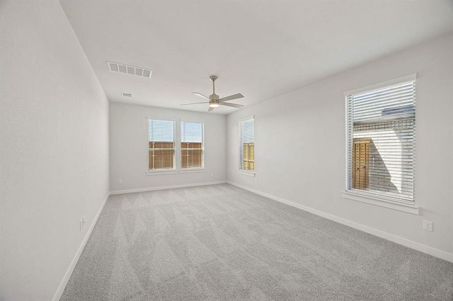 Primary Suite in the Wimbledon home plan by Trophy Signature Homes – REPRESENTATIVE PHOTO