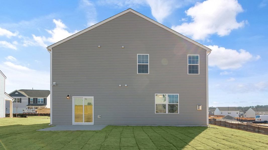 Exterior details and patio area of a home in Ridgewood Farms, Winterville (Image 22).