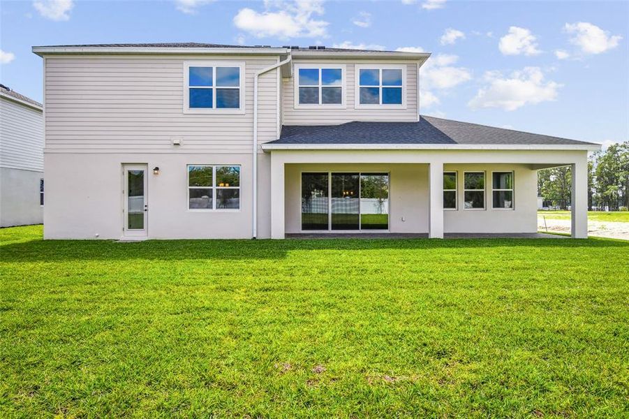 Exterior details and patio area of a home in Solace at Corner Lake, Orlando (Image 4).
