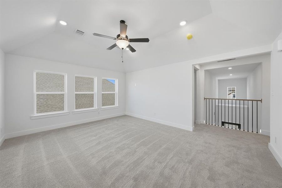Unfurnished room featuring light colored carpet, recessed lighting, a ceiling fan, and lofted ceiling Unfurnished room featuring light colored carpet, recessed lighting, a ceiling fan, and lofted ceiling
