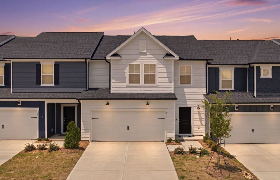 Front exterior of a new home in Saunders Farm, Willow Spring, NC, highlighting curb appeal (Image 18).