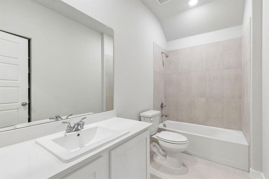 Bathroom in the Oscar home plan by Trophy Signature Homes – REPRESENTATIVE PHOTO