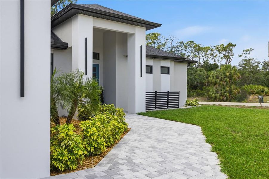 Exterior details and patio area of a home in , North Port (Image 33).