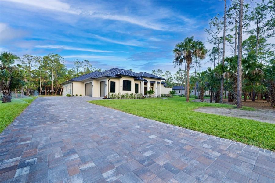 Front exterior of a new home in , Naples, FL, highlighting curb appeal (Image 21).
