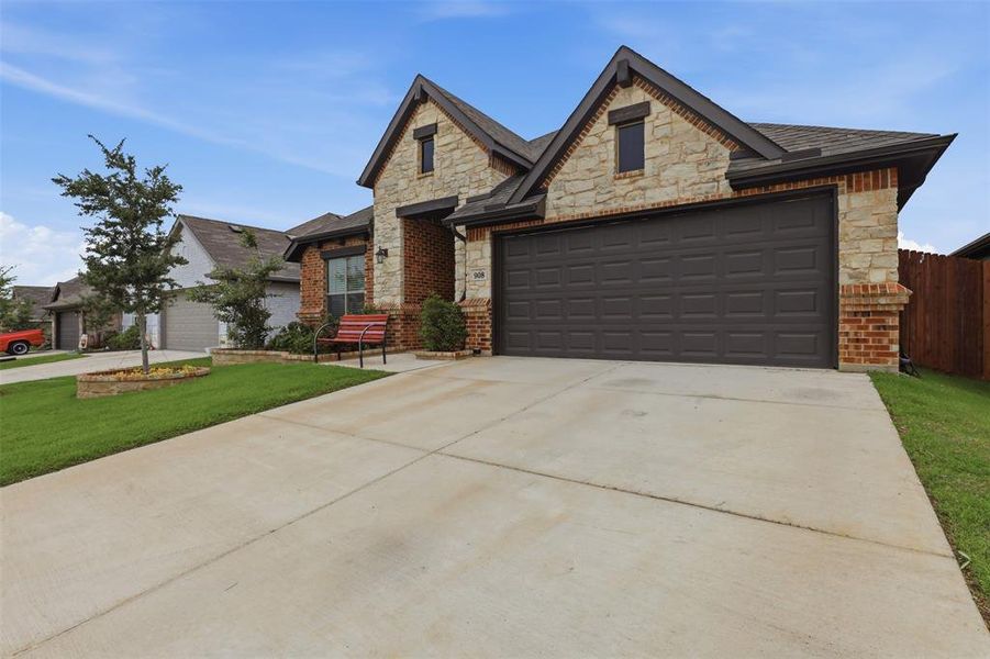 Front exterior of a new home in Chisholm Hills, Cleburne, TX, highlighting curb appeal (Image 22).