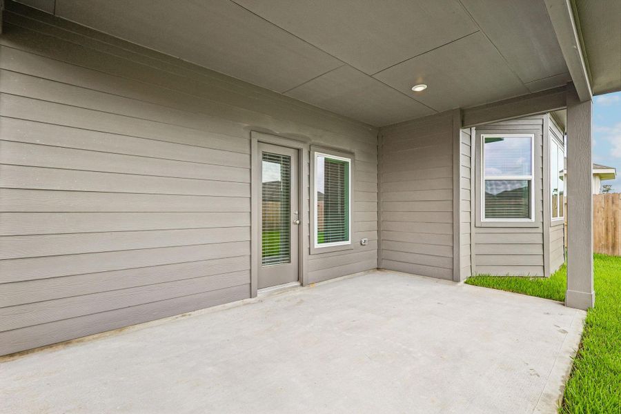 Exterior details and patio area of a home in Riviera Pines - Premier Series, Huffman (Image 18).