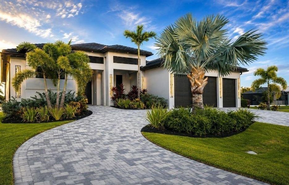 Front exterior of a new home in , Cape Coral, FL, highlighting curb appeal (Image 25). Front exterior of a new home in , Cape Coral, FL, highlighting curb appeal (Image 25).