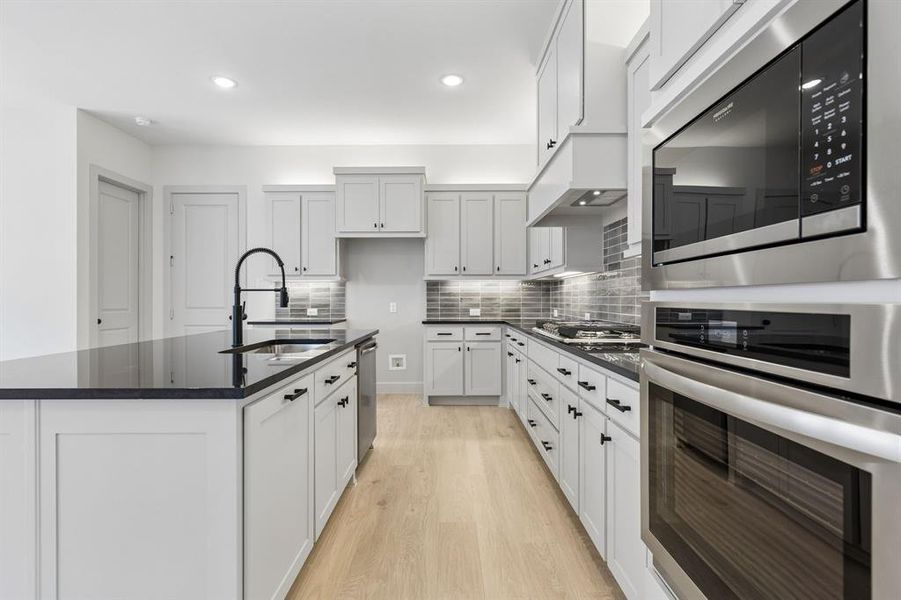 Fantastic storage paired with beautiful finishes combine to create the kitchen of your dreams in our Bella plan! Fantastic storage paired with beautiful finishes combine to create the kitchen of your dreams in our Bella plan!