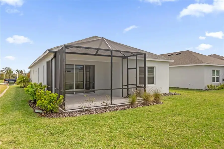 Exterior details and patio area of a home in Canoe Creek, Parrish (Image 3).
