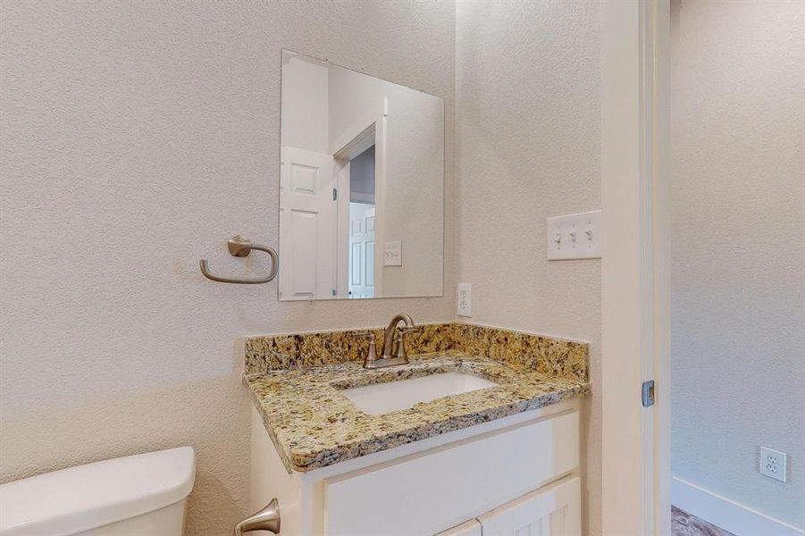 Bathroom with vanity and toilet