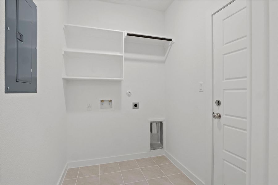 Laundry room with electric panel, washer hookup, hookup for an electric dryer, hookup for a gas dryer, and light tile patterned floors