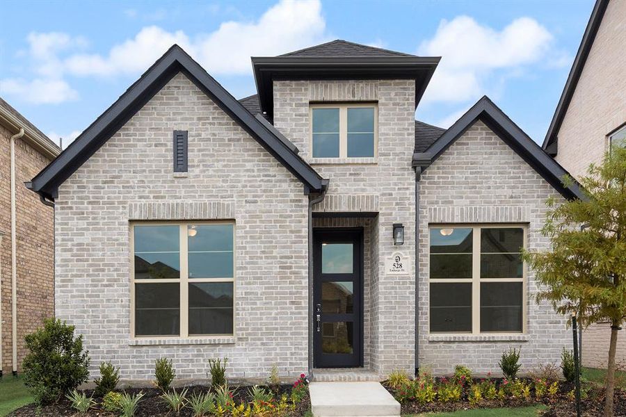 Front exterior of a new home in Edgewater, Fate, TX, highlighting curb appeal (Image 24).