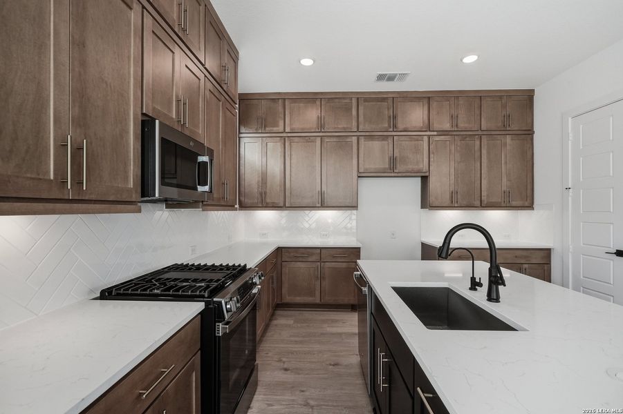 Furnished interior view inside a new home in Centero at Stone Oak, San Antonio (Image 14).