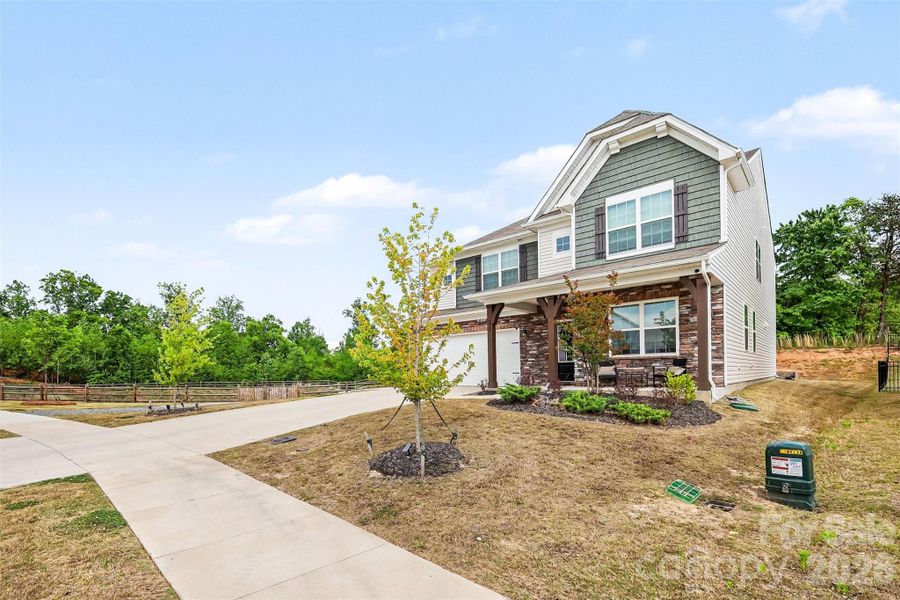 Front exterior of a new home in Gambill Forest: Enclave, Mooresville, NC, highlighting curb appeal (Image 21).