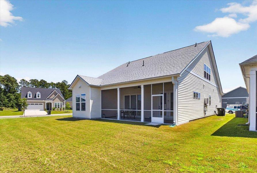Exterior details and patio area of a home in Summerwind Crossing at Lakes of Cane Bay, Summerville (Image 28).