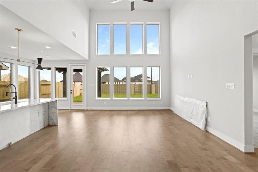 *REPRESENTATION PHOTO* Grand Family Room With Large Windows & Luxury Hardwoods