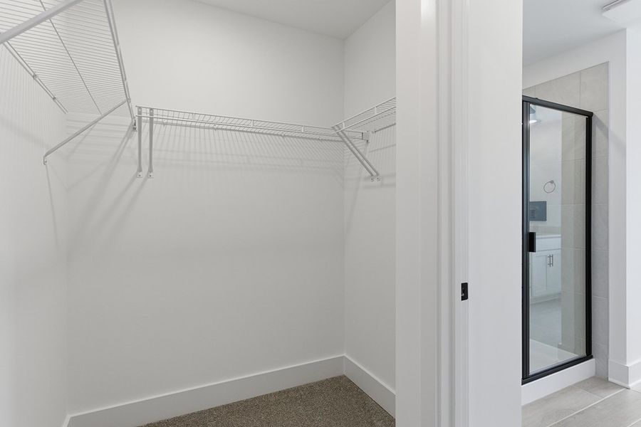 A white room with a glass door.