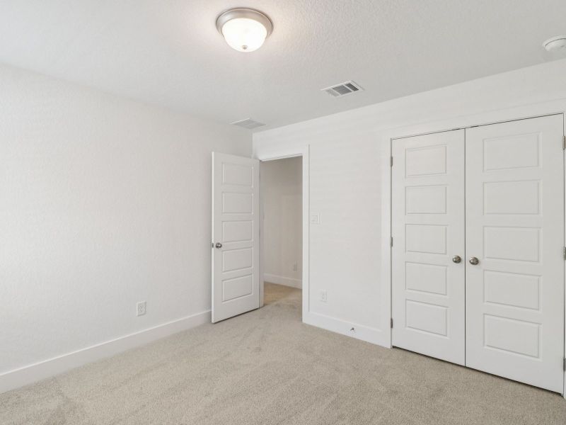 Guest bedroom in the Matador floorplan at a Meritage Homes community. Guest bedroom in the Matador floorplan at a Meritage Homes community.