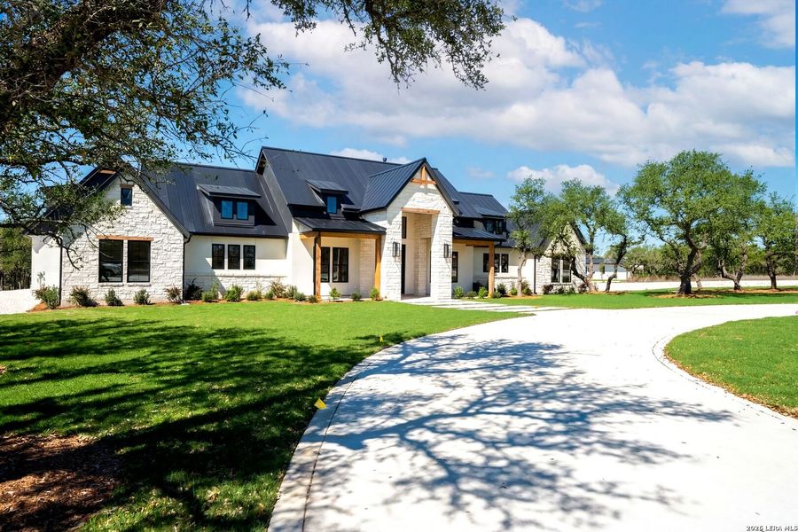 Front exterior of a new home in , Bulverde, TX, highlighting curb appeal (Image 27). Front exterior of a new home in , Bulverde, TX, highlighting curb appeal (Image 27).