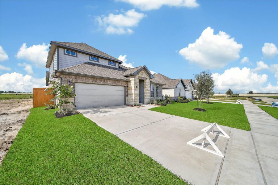 Front exterior of a new home in , Rosharon, TX, highlighting curb appeal (Image 19).