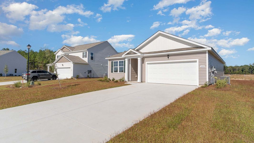 Representative exterior photo of a completed home built from the ARIA by D.R. Horton in Sandridge Park, Little River, SC (Image 15).