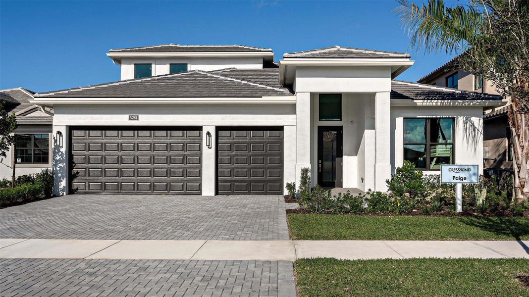 Front exterior of a new home in Cresswind Palm Beach at Westlake, Westlake, FL, highlighting curb appeal (Image 20).