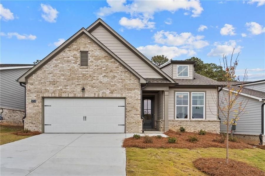 Front exterior of a new home in Kelly Preserve, Loganville, GA, highlighting curb appeal (Image 4).