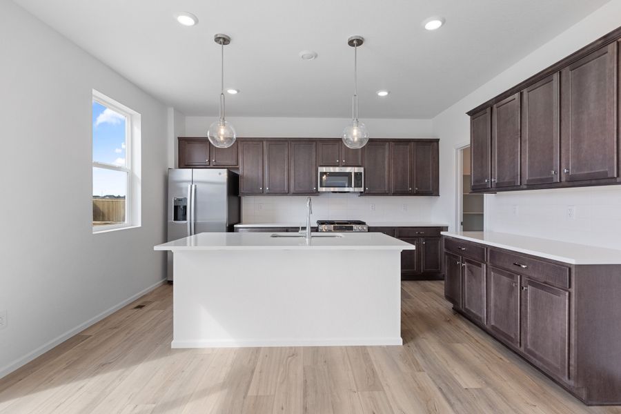 Furnished interior view inside a new home in The Cottages Collection at Ridgeline Vista, Brighton (Image 3).