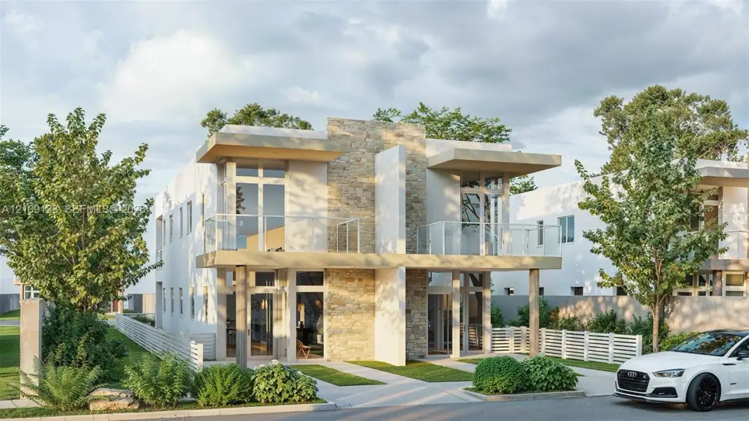 Contemporary exterior featuring light-toned smooth stucco, a natural stone masonry façade, dual upper-level balconies with glass railings, and expansive floor-to-ceiling windows Contemporary exterior featuring light-toned smooth stucco, a natural stone masonry façade, dual upper-level balconies with glass railings, and expansive floor-to-ceiling windows