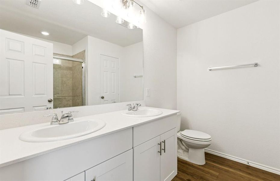 Owner's private bath with double vanity